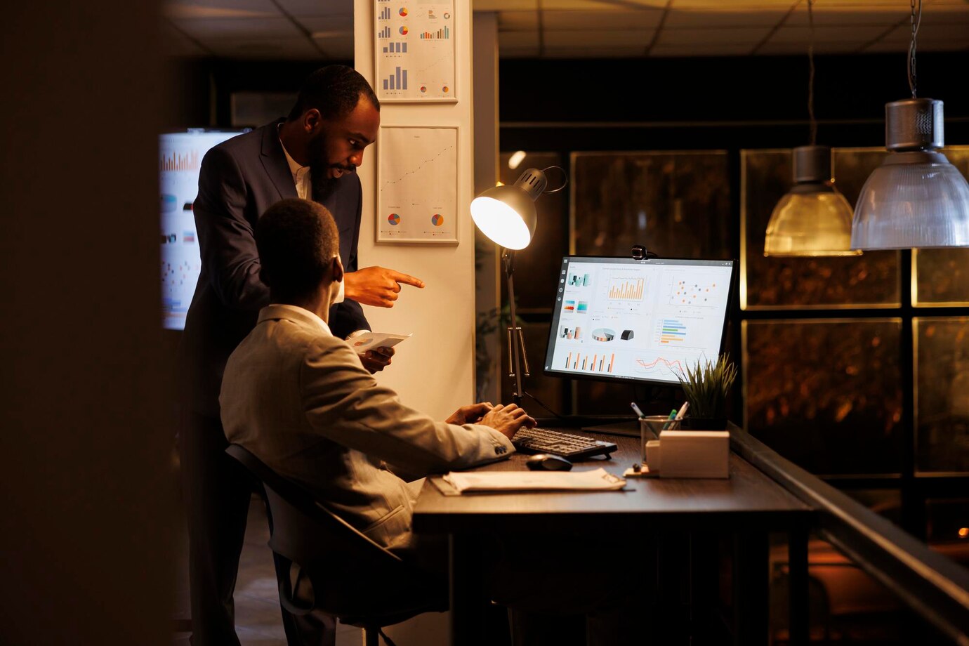 TechUp engineer monitoring application performance on laptop