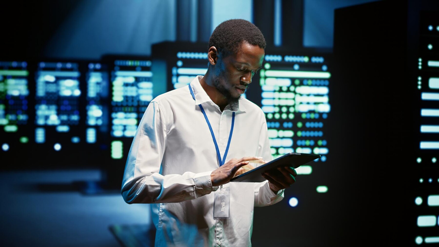 TechUp engineer monitoring application performance on laptop