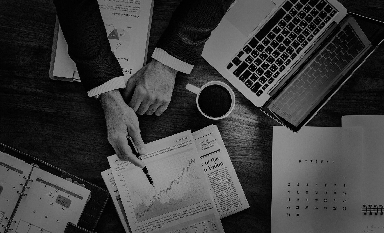 TechUp engineer monitoring application performance on laptop